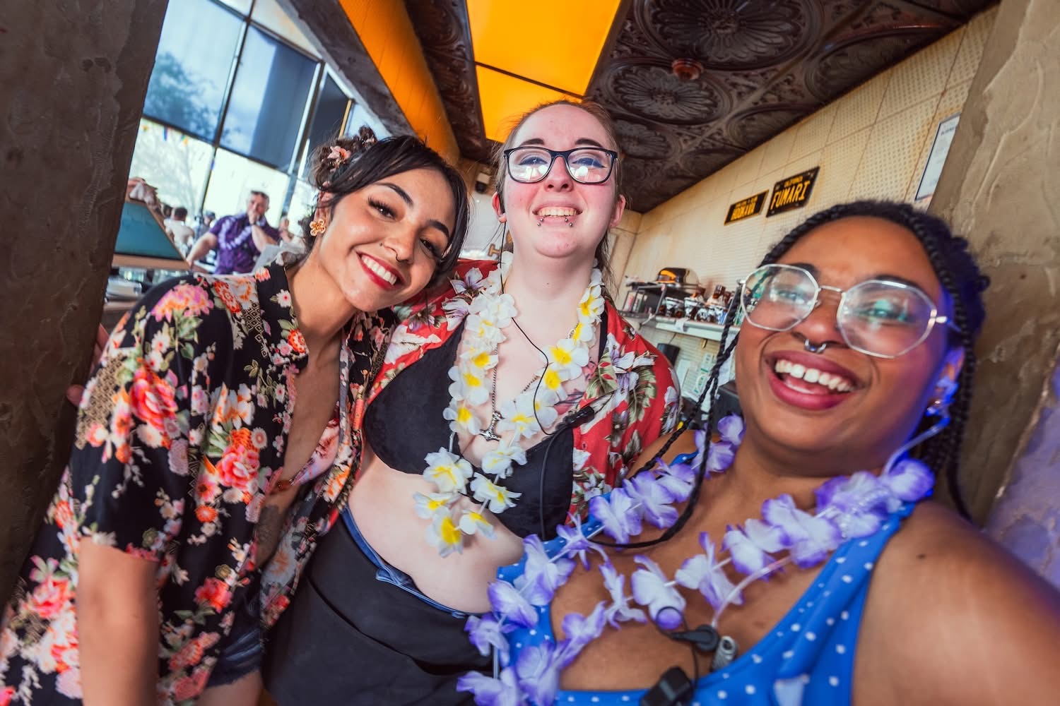 Guests celebrating at Hookava during a Crawl Reno Mimosa Crawl with leis
