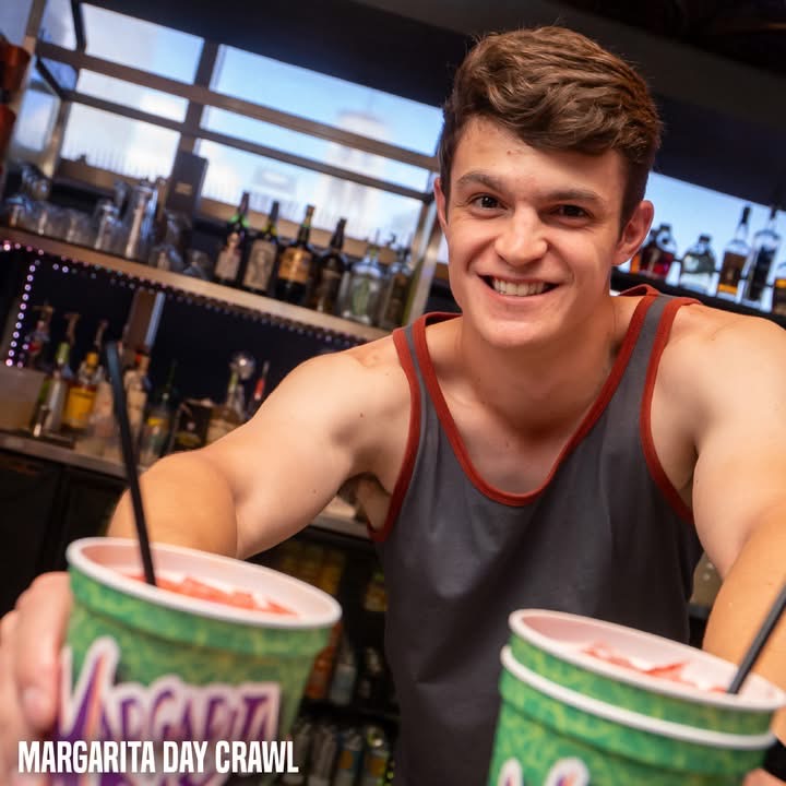 Hookava bartender serving Margarita Day Crawl drinks